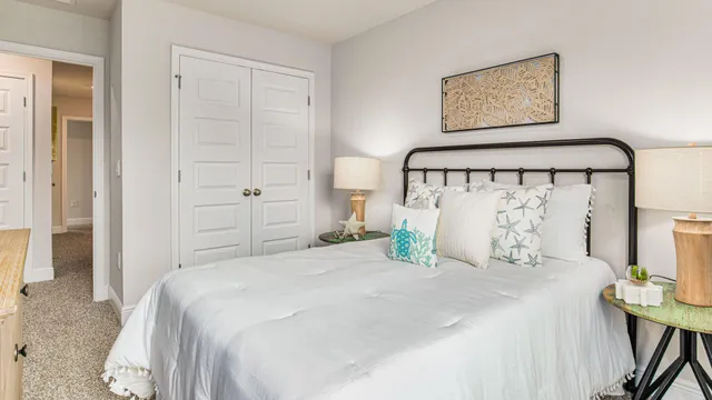 a bedroom with a bed and a view of bathroom