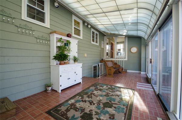 63 Buckingham Road Milton, MA 02186 - Photo 10 of 17 a view of a hallway with entryway wooden floor and windows