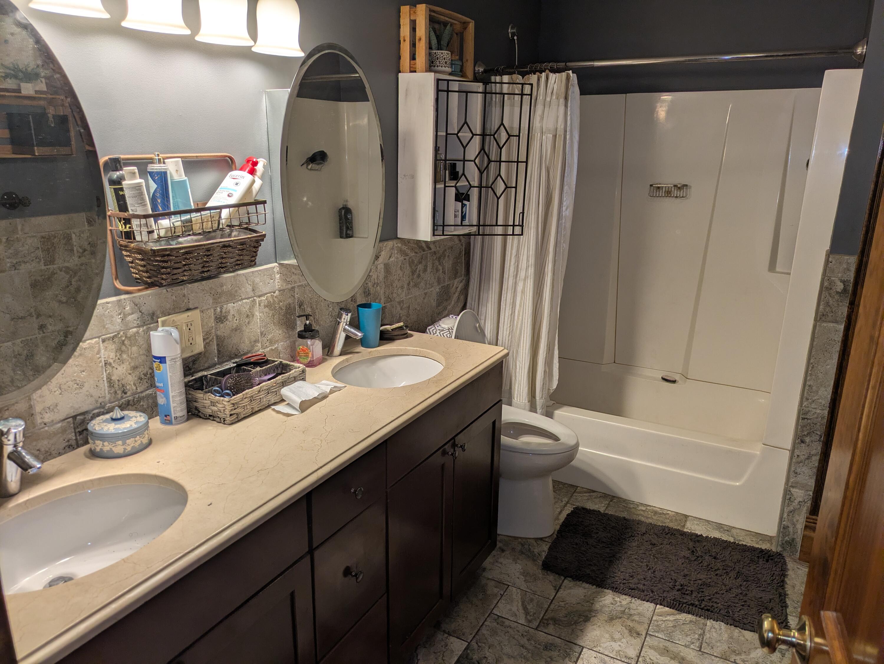 315 North Hobart Road Hobart, IN 46342 - Photo 14 of 33 a bathroom with a sink and a mirror