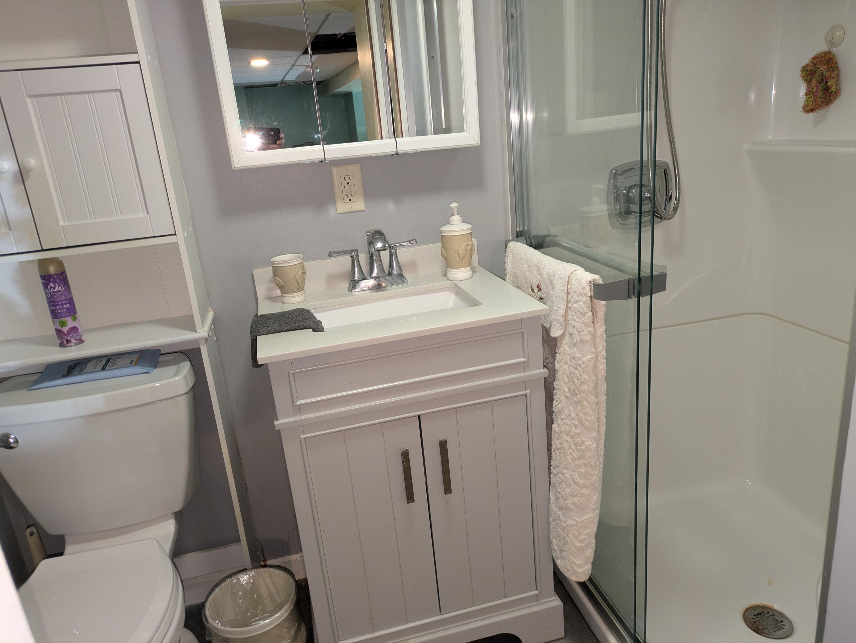 315 North Hobart Road Hobart, IN 46342 - Photo 22 of 33 a bathroom with a toilet sink and mirror