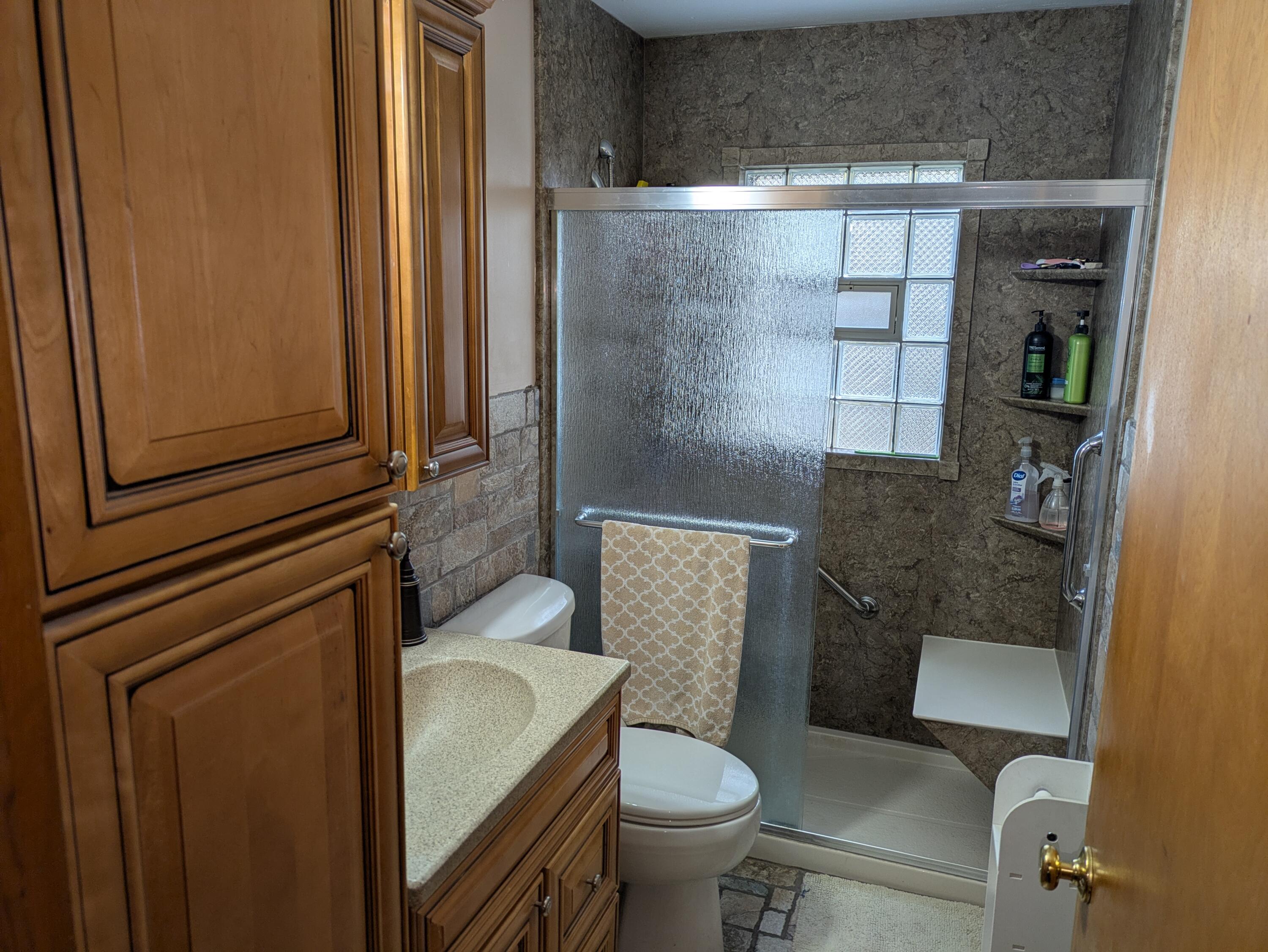 315 North Hobart Road Hobart, IN 46342 - Photo 7 of 33 a bathroom with a sink and toilet