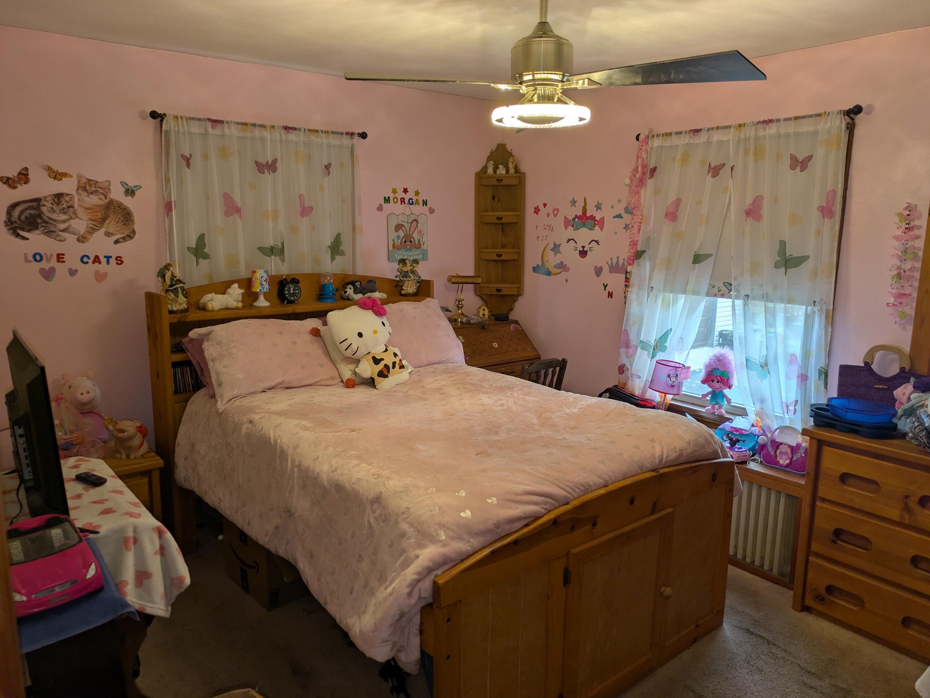 315 North Hobart Road Hobart, IN 46342 - Photo 8 of 33 a bed room with a bed mirror and a window