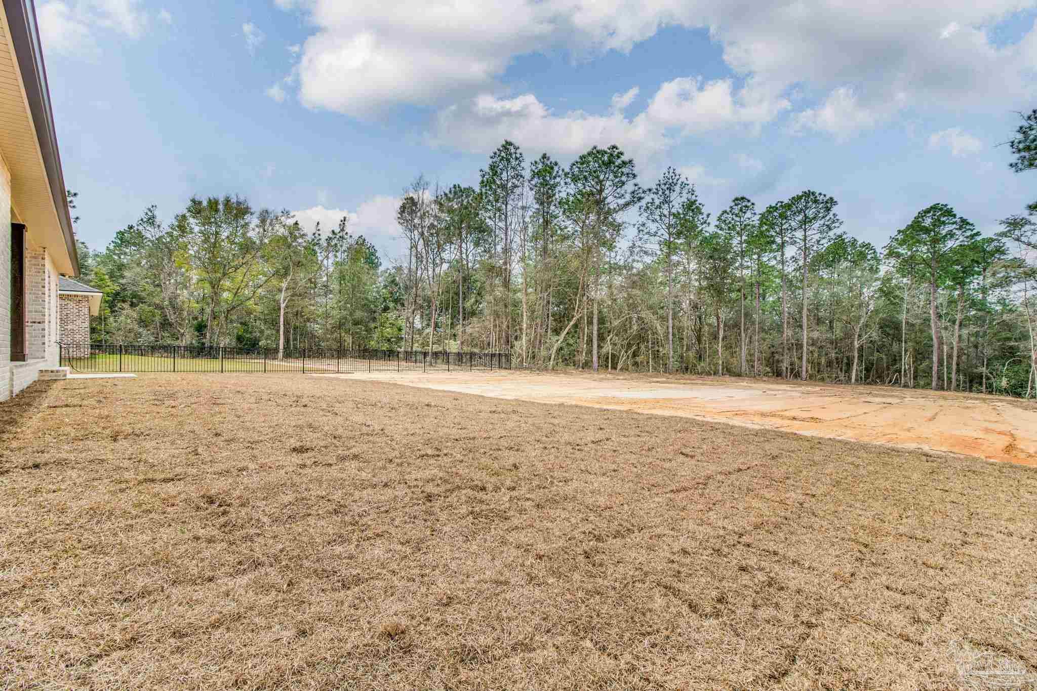 4310 Watkins Street Pace, FL 32571 - Photo 13 of 58 a view of a yard with a house