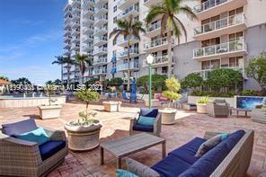 5077 Northwest 7th Street, Unit 1402 Miami, FL 33126 - Photo 20 of 87 a outdoor living space with patio furniture and a potted plant