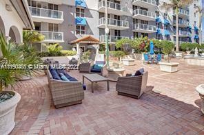 5077 Northwest 7th Street, Unit 1402 Miami, FL 33126 - Photo 23 of 87 a view of a patio with couches and potted plants
