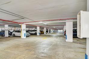5077 Northwest 7th Street, Unit 1402 Miami, FL 33126 - Photo 30 of 87 a view of a livingroom with furniture and a ceiling fan