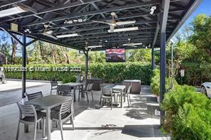 5077 Northwest 7th Street, Unit 1402 Miami, FL 33126 - Photo 34 of 87 a view of an outdoor dining space with furniture