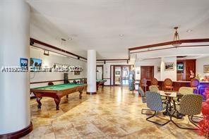 5077 Northwest 7th Street, Unit 1402 Miami, FL 33126 - Photo 6 of 87 a living room with fireplace furniture and a large window