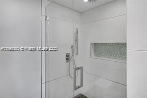 5077 Northwest 7th Street, Unit 1402 Miami, FL 33126 - Photo 66 of 87 a bathroom with a shower