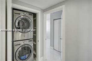 5077 Northwest 7th Street, Unit 1402 Miami, FL 33126 - Photo 74 of 87 a view of a hallway with washer and dryer