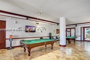 5077 Northwest 7th Street, Unit 1402 Miami, FL 33126 - Photo 8 of 87 a living room with furniture pool table table and a large window
