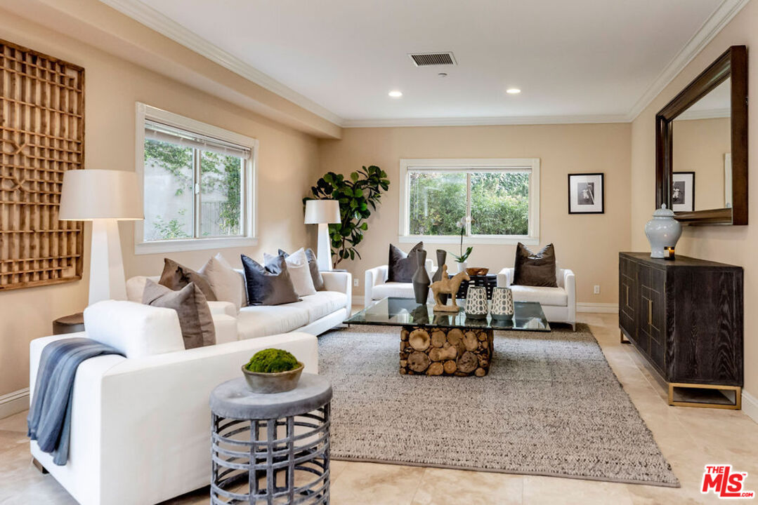 7634 Rocky Mountain View Road Tujunga, CA 91042 - Photo 15 of 50 a living room with fireplace furniture and a large window