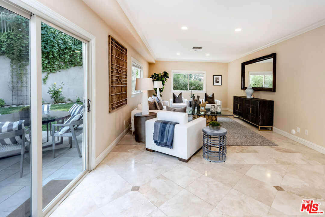 7634 Rocky Mountain View Road Tujunga, CA 91042 - Photo 16 of 50 a living room with furniture and a flat screen tv