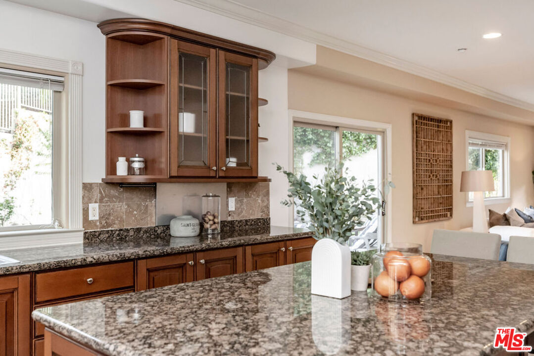 7634 Rocky Mountain View Road Tujunga, CA 91042 - Photo 17 of 50 a kitchen with a large window appliances and cabinets