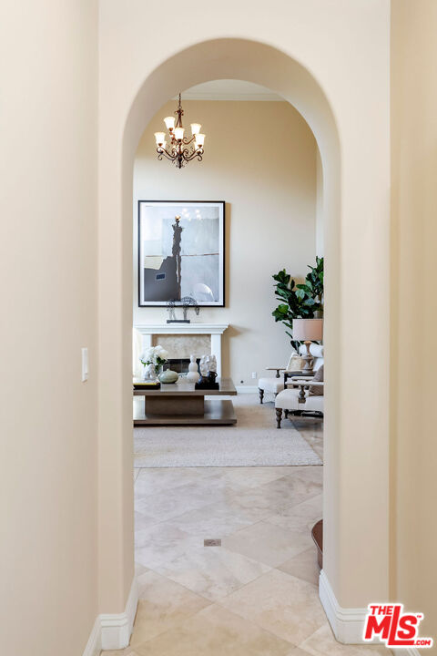 7634 Rocky Mountain View Road Tujunga, CA 91042 - Photo 20 of 50 a living room with furniture and a chandelier