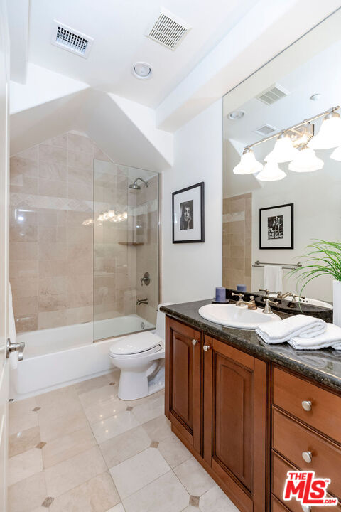7634 Rocky Mountain View Road Tujunga, CA 91042 - Photo 26 of 50 a bathroom with a granite countertop sink toilet and shower
