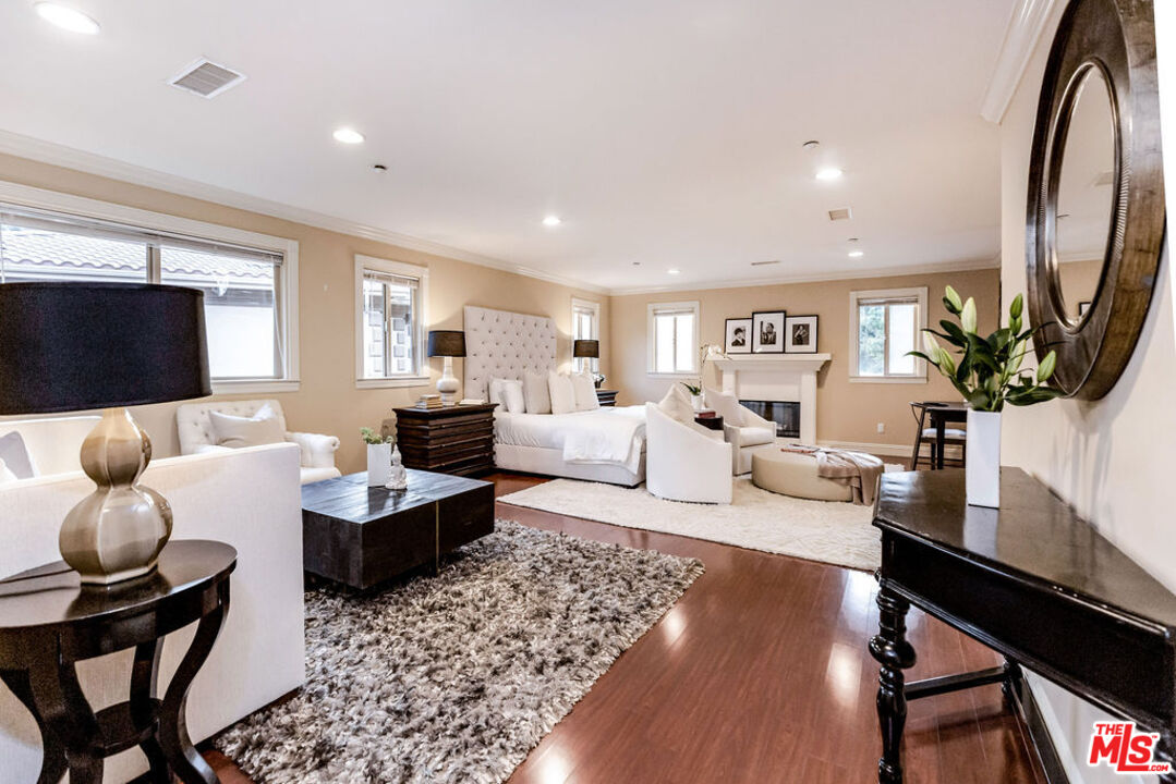 7634 Rocky Mountain View Road Tujunga, CA 91042 - Photo 33 of 50 a living room with fireplace furniture and a flat screen tv