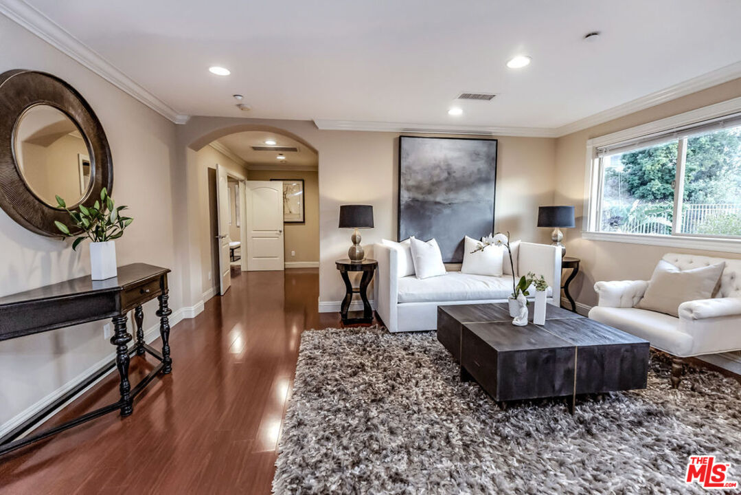 7634 Rocky Mountain View Road Tujunga, CA 91042 - Photo 34 of 50 a living room with furniture and a large window