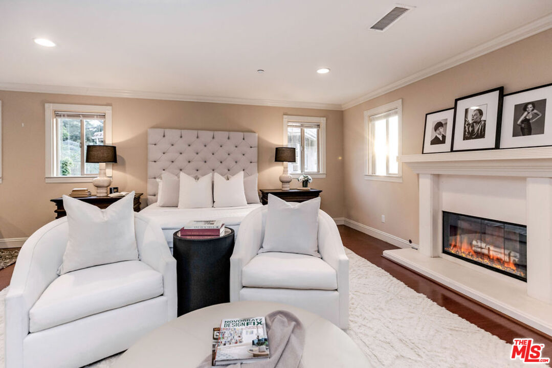 7634 Rocky Mountain View Road Tujunga, CA 91042 - Photo 36 of 50 a living room with furniture and a fireplace