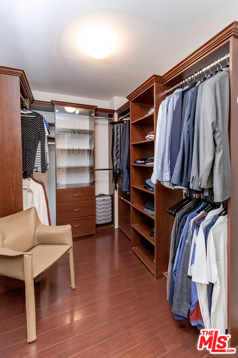 7634 Rocky Mountain View Road Tujunga, CA 91042 - Photo 37 of 50 a view of walk in closet with clothes and shoes