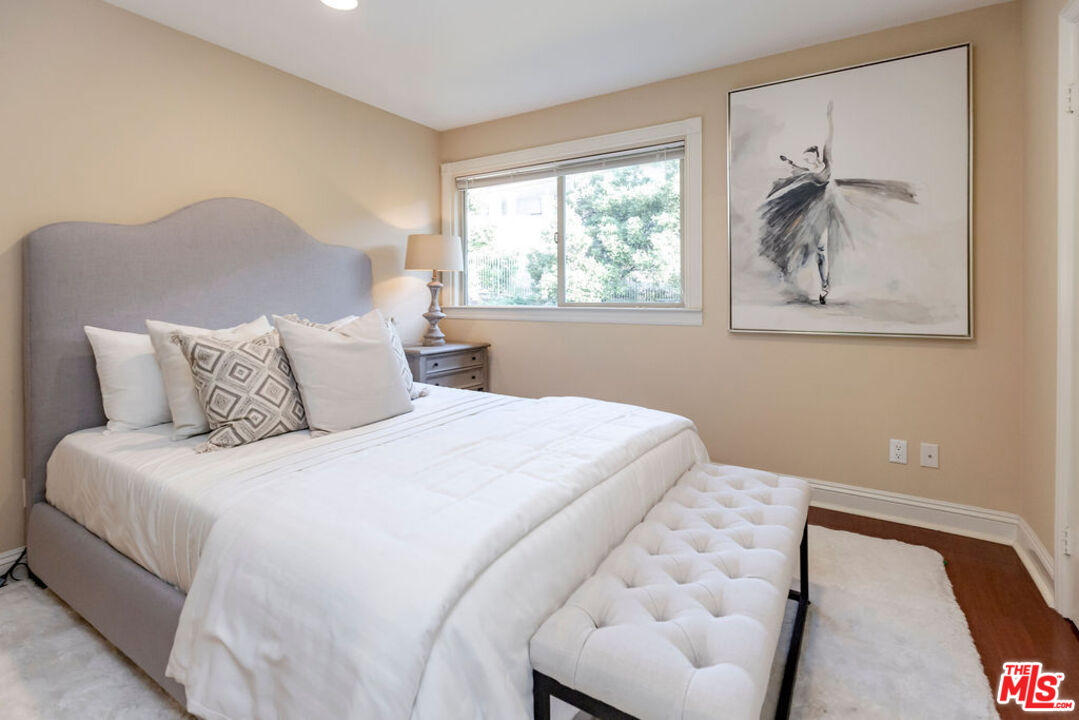 7634 Rocky Mountain View Road Tujunga, CA 91042 - Photo 39 of 50 a bedroom with a bed and a painting on the wall