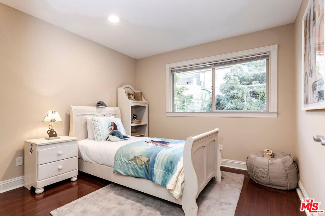 7634 Rocky Mountain View Road Tujunga, CA 91042 - Photo 41 of 50 a bedroom with a bed and a window