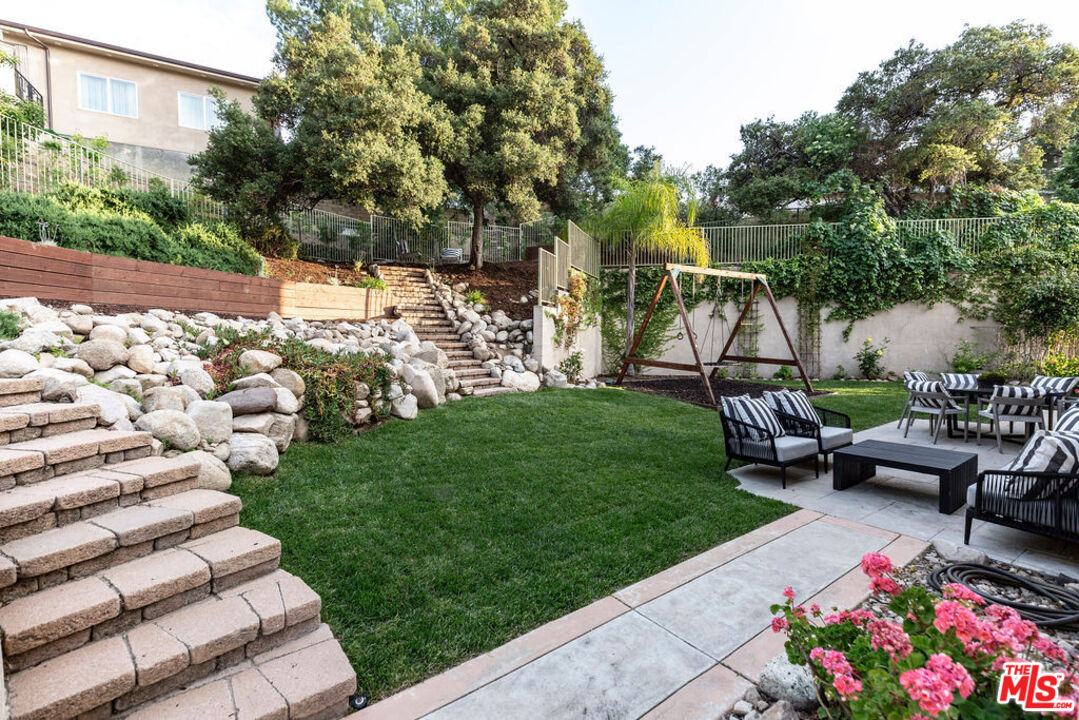 7634 Rocky Mountain View Road Tujunga, CA 91042 - Photo 43 of 50 a garden view with a seating space