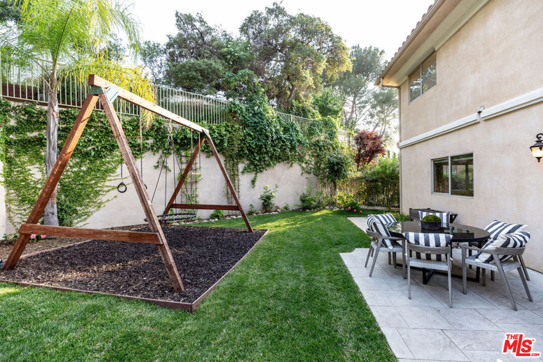 7634 Rocky Mountain View Road Tujunga, CA 91042 - Photo 44 of 50 a view of a house with a backyard and slide