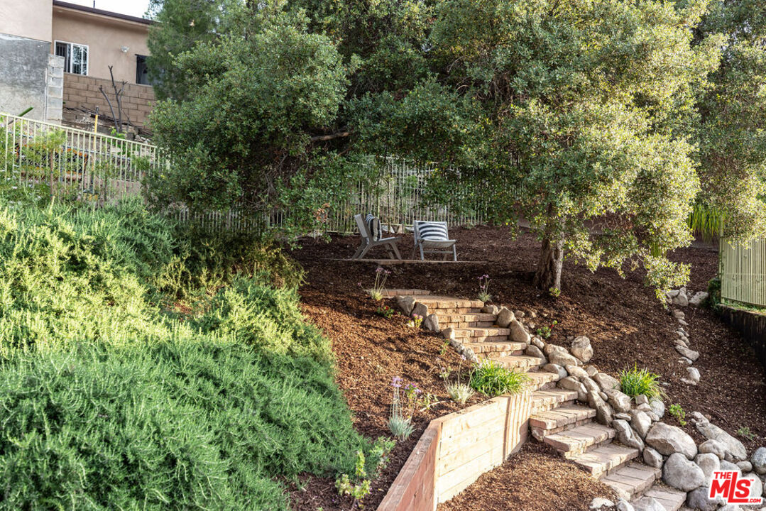 7634 Rocky Mountain View Road Tujunga, CA 91042 - Photo 46 of 50 a backyard of a house with lots of green space