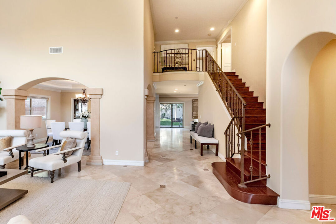 7634 Rocky Mountain View Road Tujunga, CA 91042 - Photo 5 of 50 a living room with furniture and a chandelier