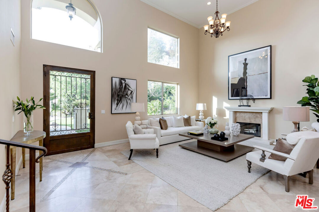 7634 Rocky Mountain View Road Tujunga, CA 91042 - Photo 6 of 50 a living room with furniture large window and flat screen tv