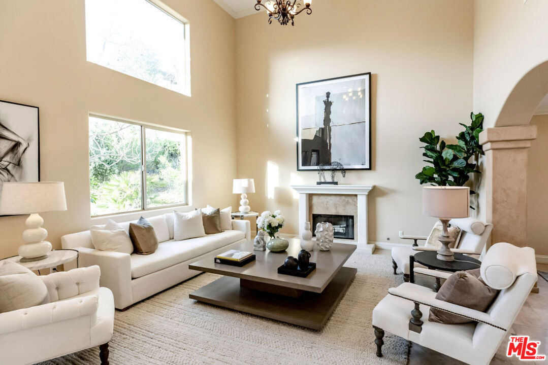 7634 Rocky Mountain View Road Tujunga, CA 91042 - Photo 8 of 50 a living room with furniture fireplace and a large window