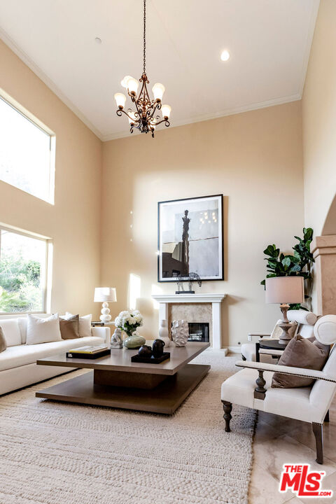7634 Rocky Mountain View Road Tujunga, CA 91042 - Photo 9 of 50 a living room with furniture and a chandelier