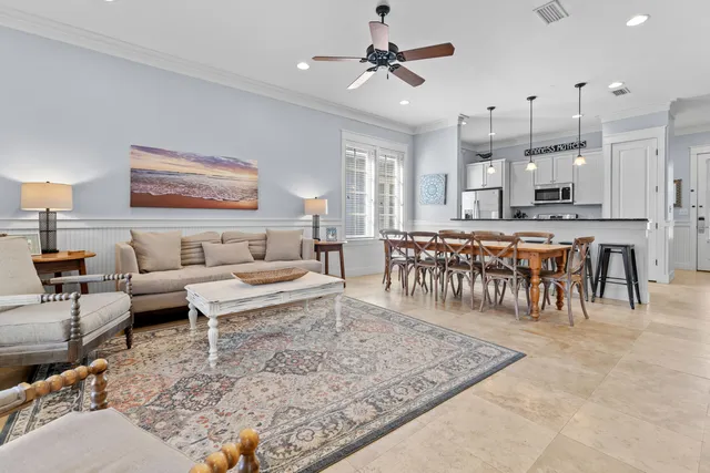 a living room with lots of furniture and a rug