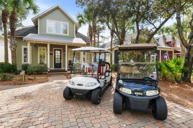 a view of a chairs and table in backyard of the house