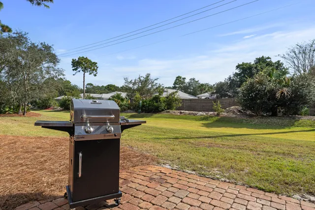 a view of a water fountain and a big yard