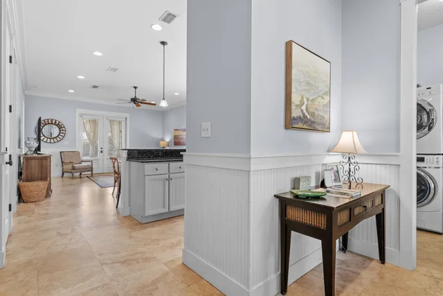 a living room with kitchen island furniture and a kitchen view