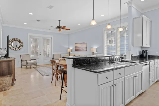 a kitchen with center island table and chairs in it