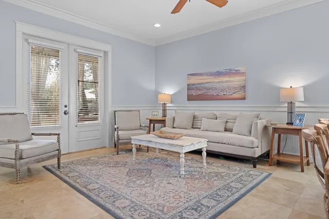 a living room with furniture and a rug