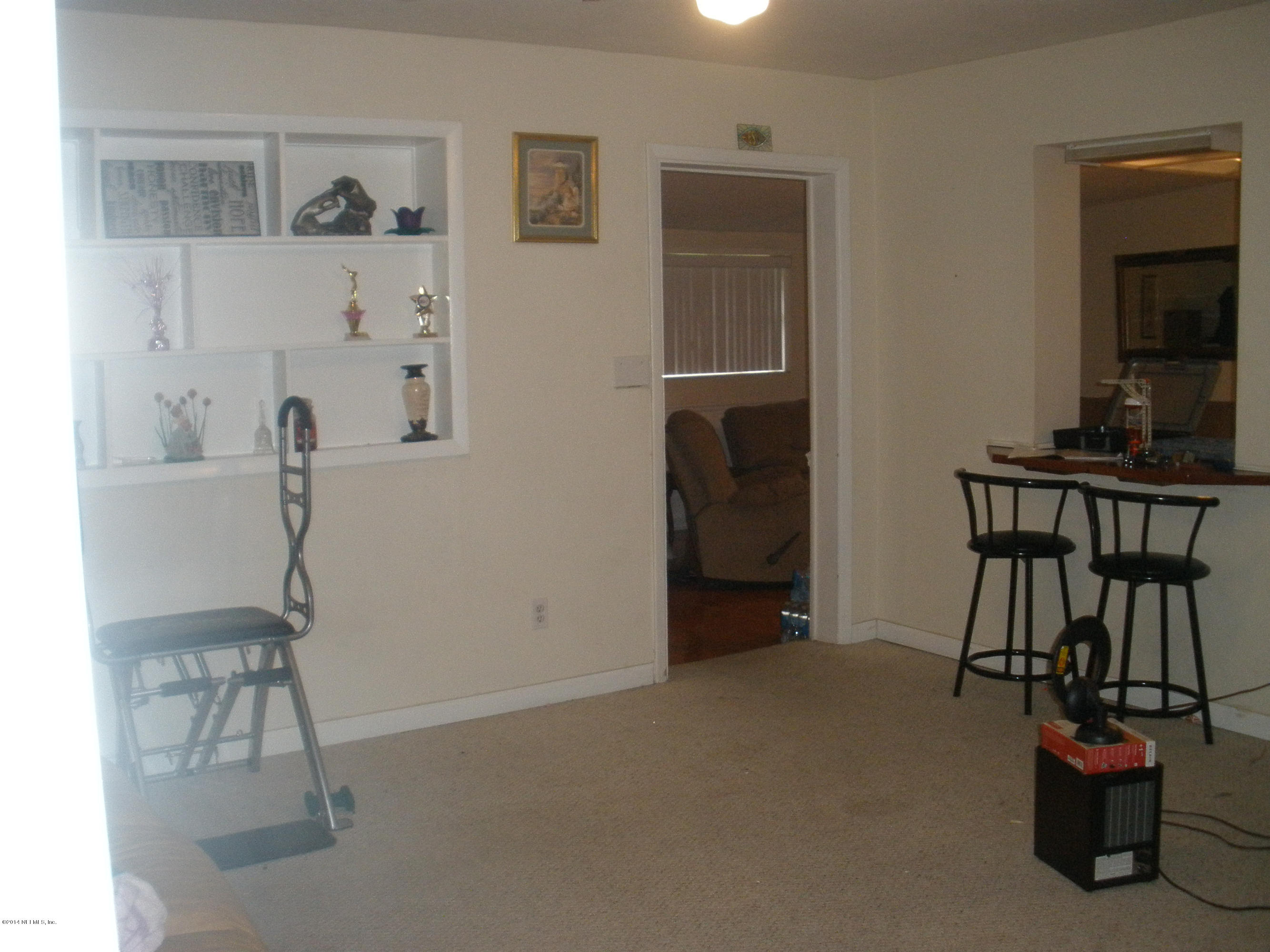 6936 Clovis Road Jacksonville, FL 32205 - Photo 3 of 4 a view of workspace with furniture and entryway