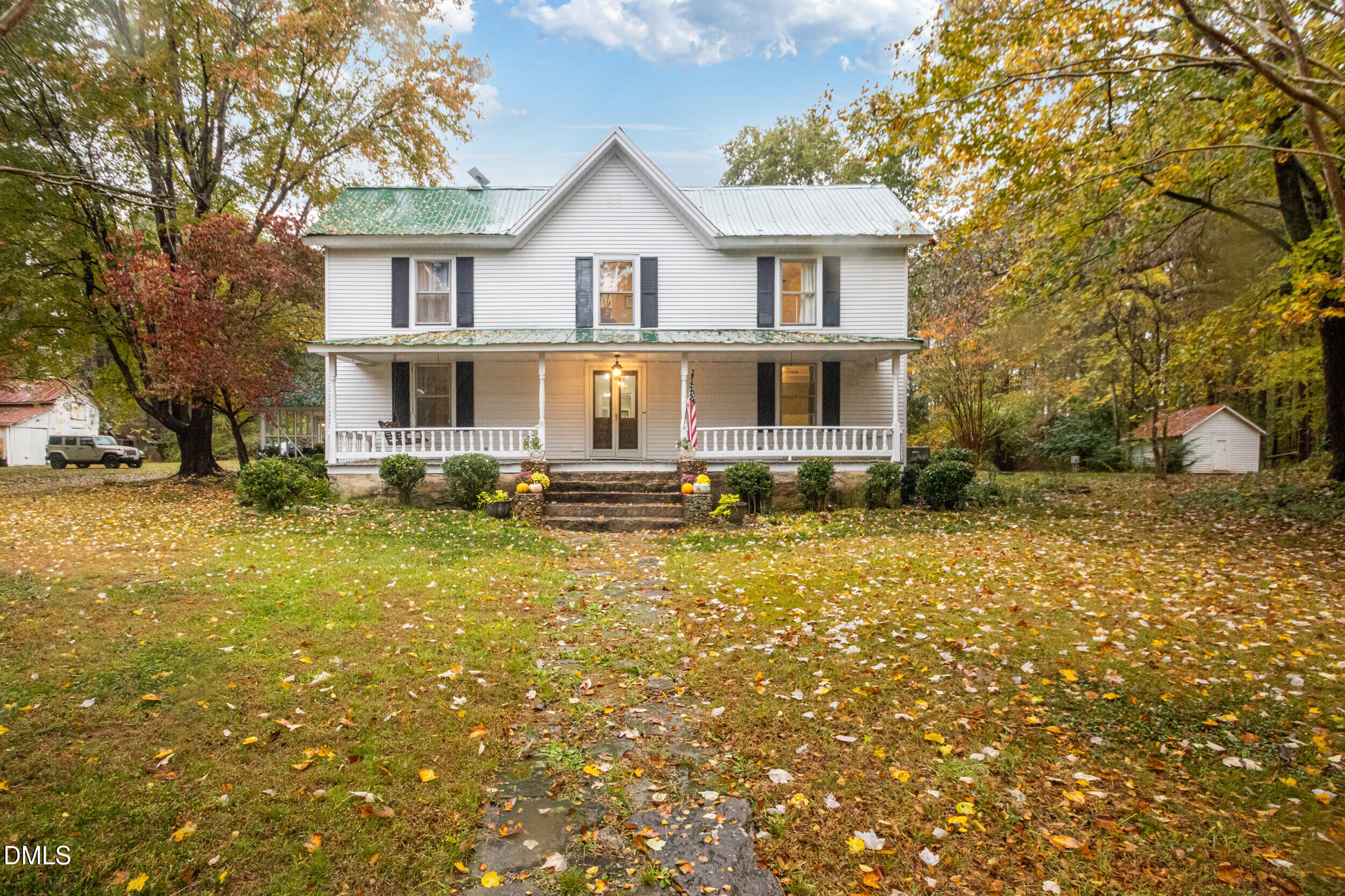1734 Rocky Ford Road Henderson, NC 27537 - Photo 1 of 44 a front view of a house with garden