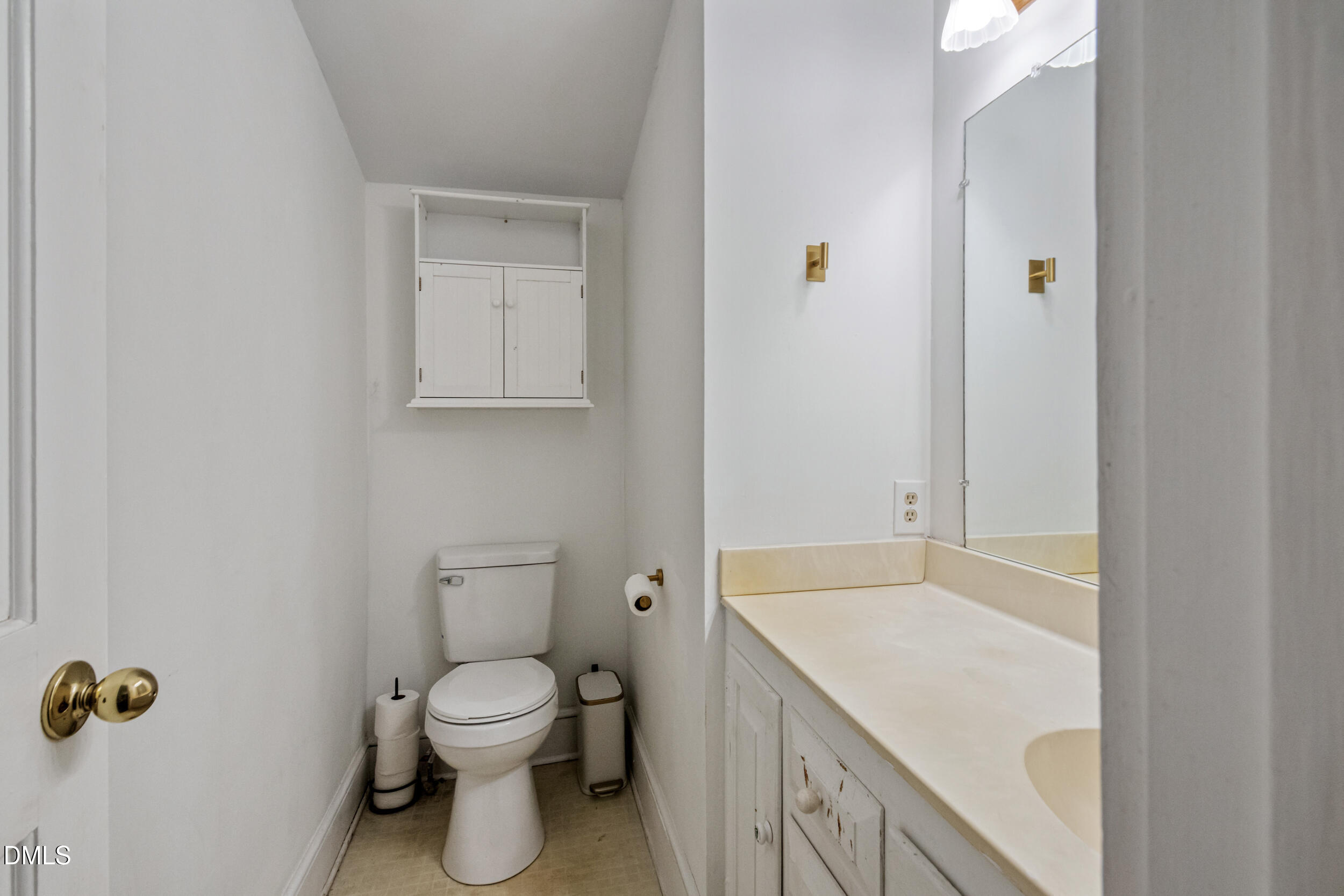 1734 Rocky Ford Road Henderson, NC 27537 - Photo 14 of 44 a bathroom with a granite countertop toilet and a sink
