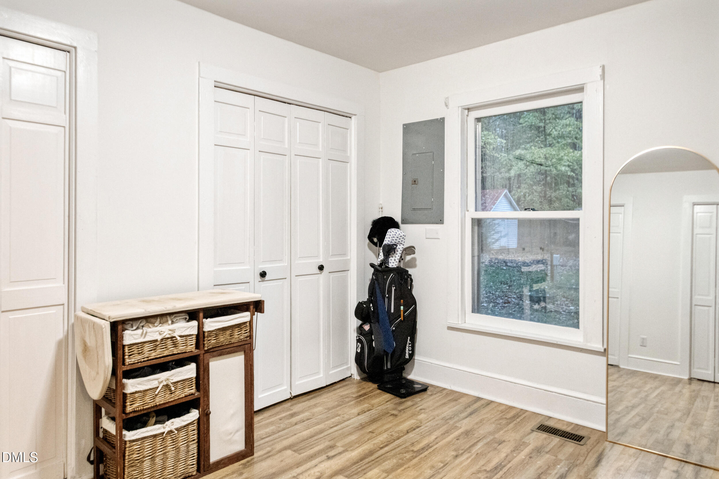 1734 Rocky Ford Road Henderson, NC 27537 - Photo 22 of 44 a view of a room with wooden floor and a window