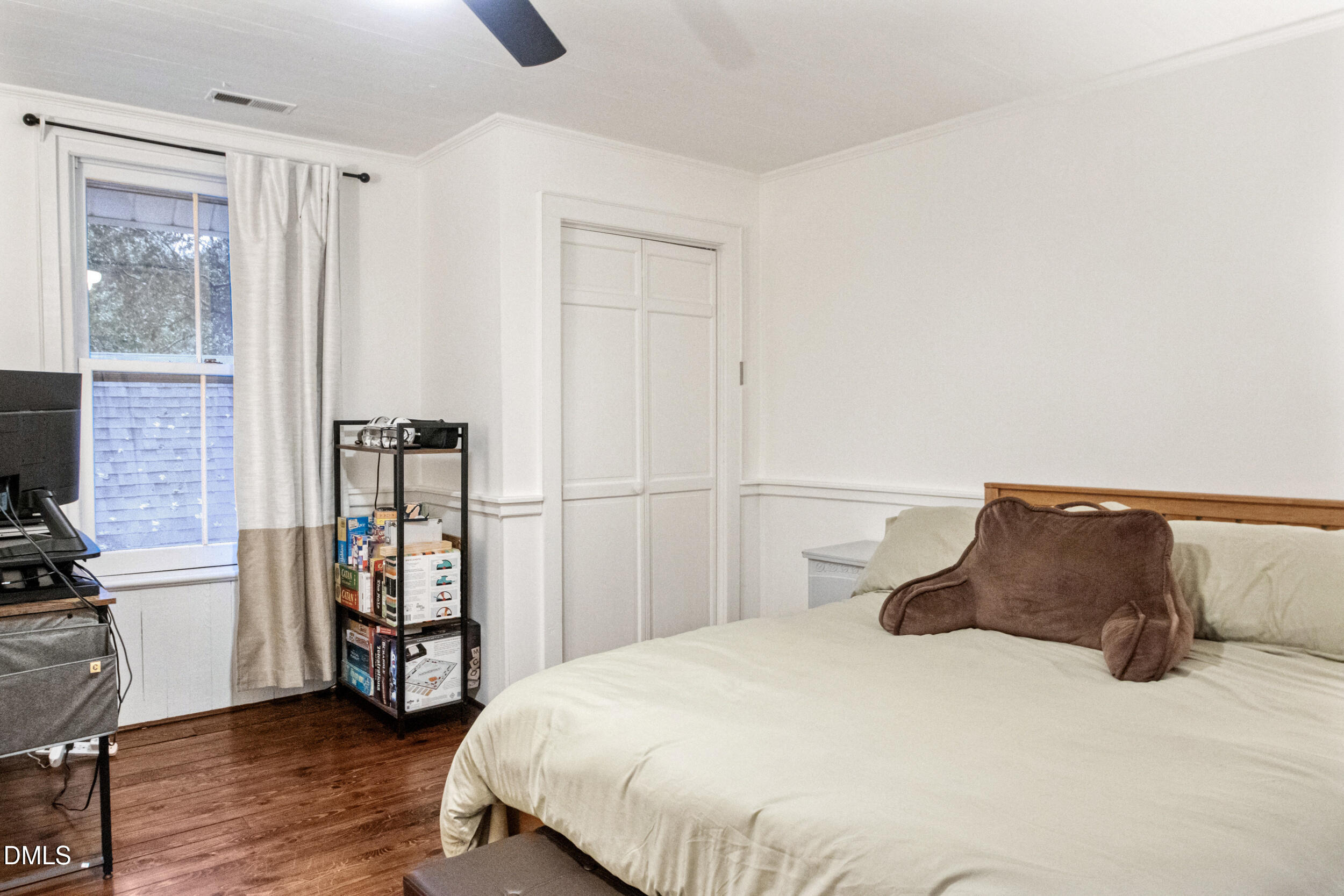 1734 Rocky Ford Road Henderson, NC 27537 - Photo 23 of 44 a bedroom with a bed and wooden floor