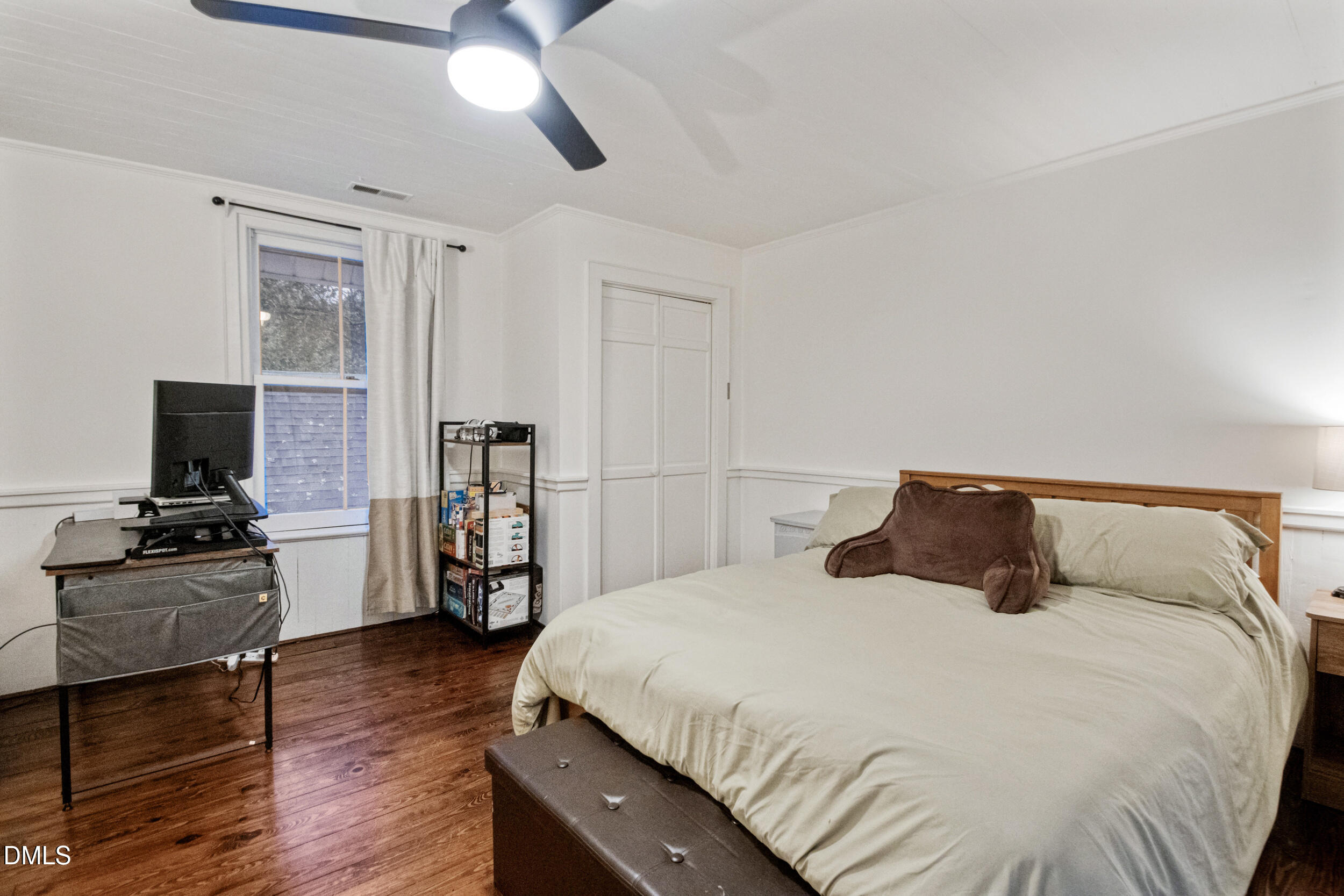 1734 Rocky Ford Road Henderson, NC 27537 - Photo 24 of 44 a bedroom with a bed and wooden floor