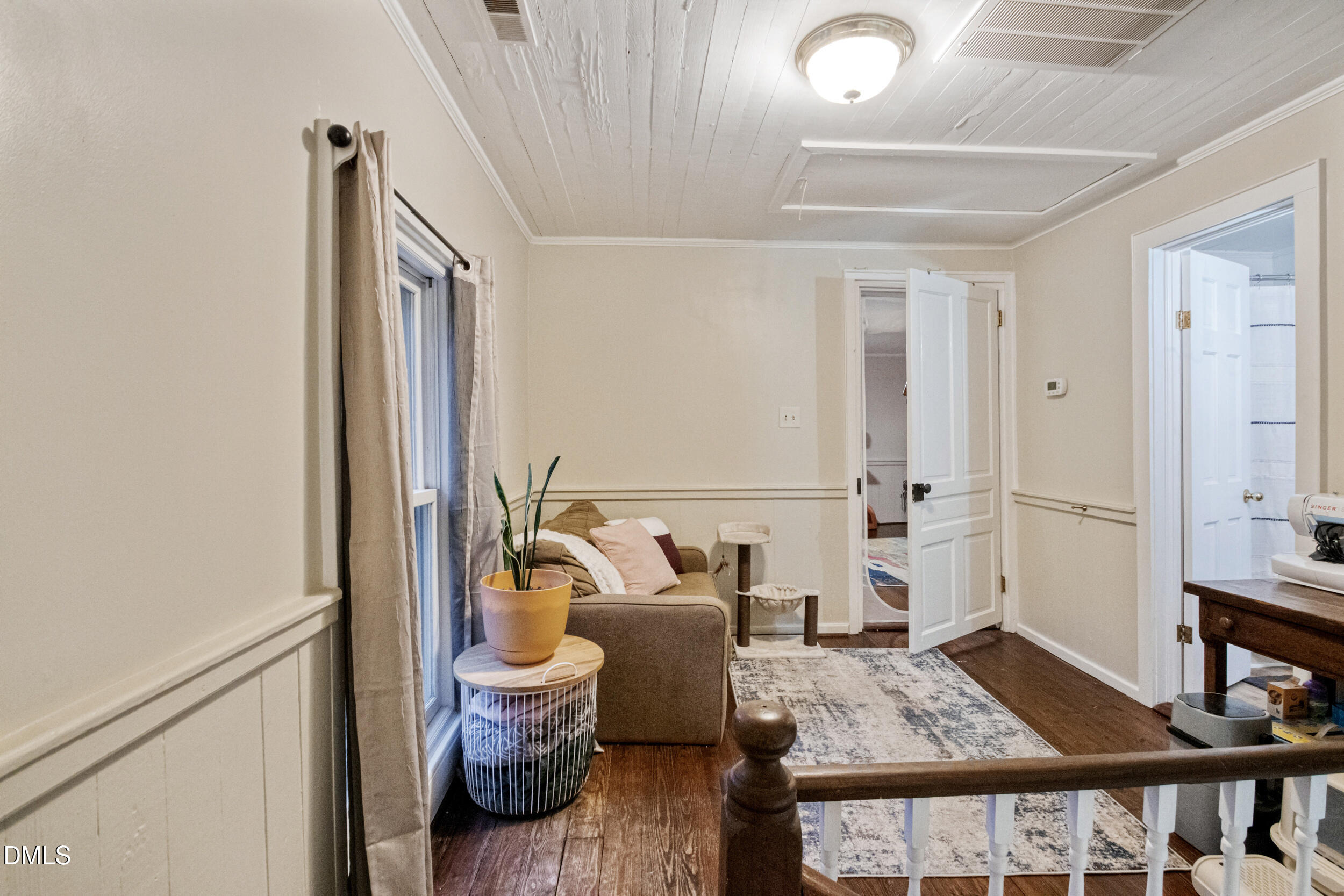 1734 Rocky Ford Road Henderson, NC 27537 - Photo 25 of 44 a living room with furniture and a table