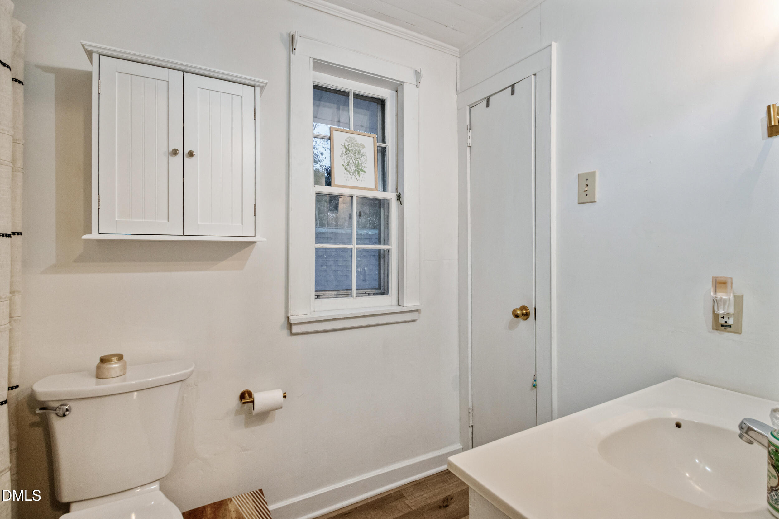 1734 Rocky Ford Road Henderson, NC 27537 - Photo 26 of 44 a bathroom with a sink a toilet and shower