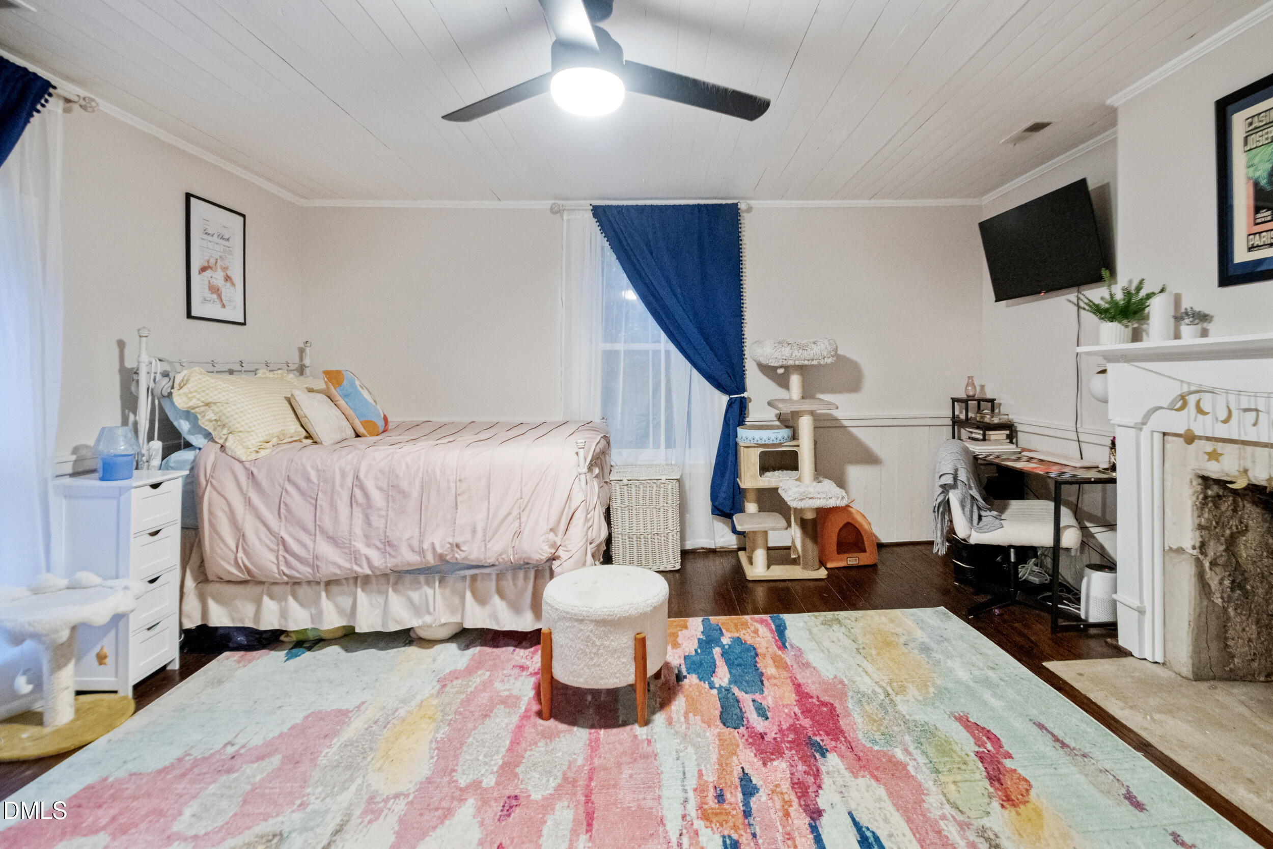 1734 Rocky Ford Road Henderson, NC 27537 - Photo 27 of 44 a bedroom with a bed and wooden floor