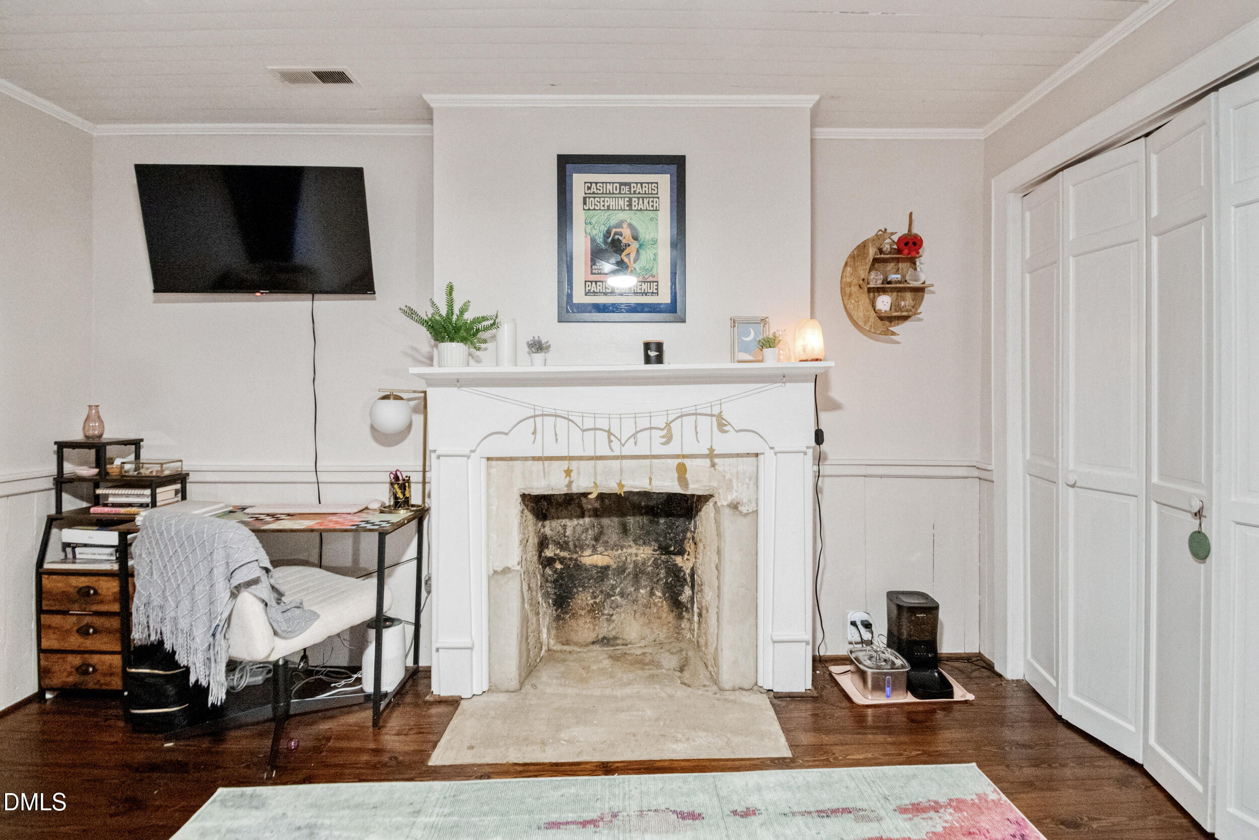 1734 Rocky Ford Road Henderson, NC 27537 - Photo 28 of 44 a living room with furniture and a flat screen tv