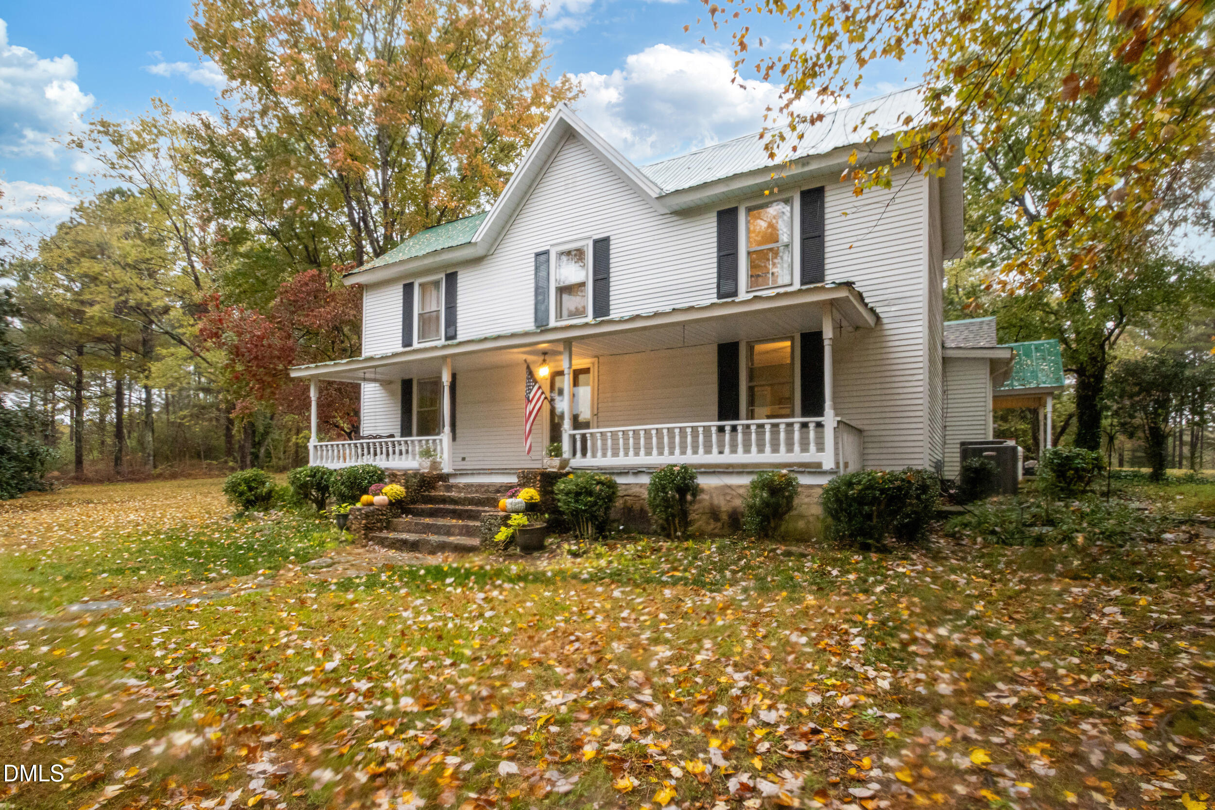1734 Rocky Ford Road Henderson, NC 27537 - Photo 2 of 44 a front view of a house with garden